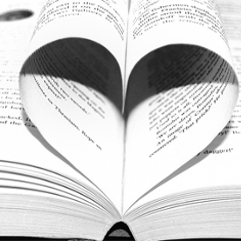 book open with pages folded into heart